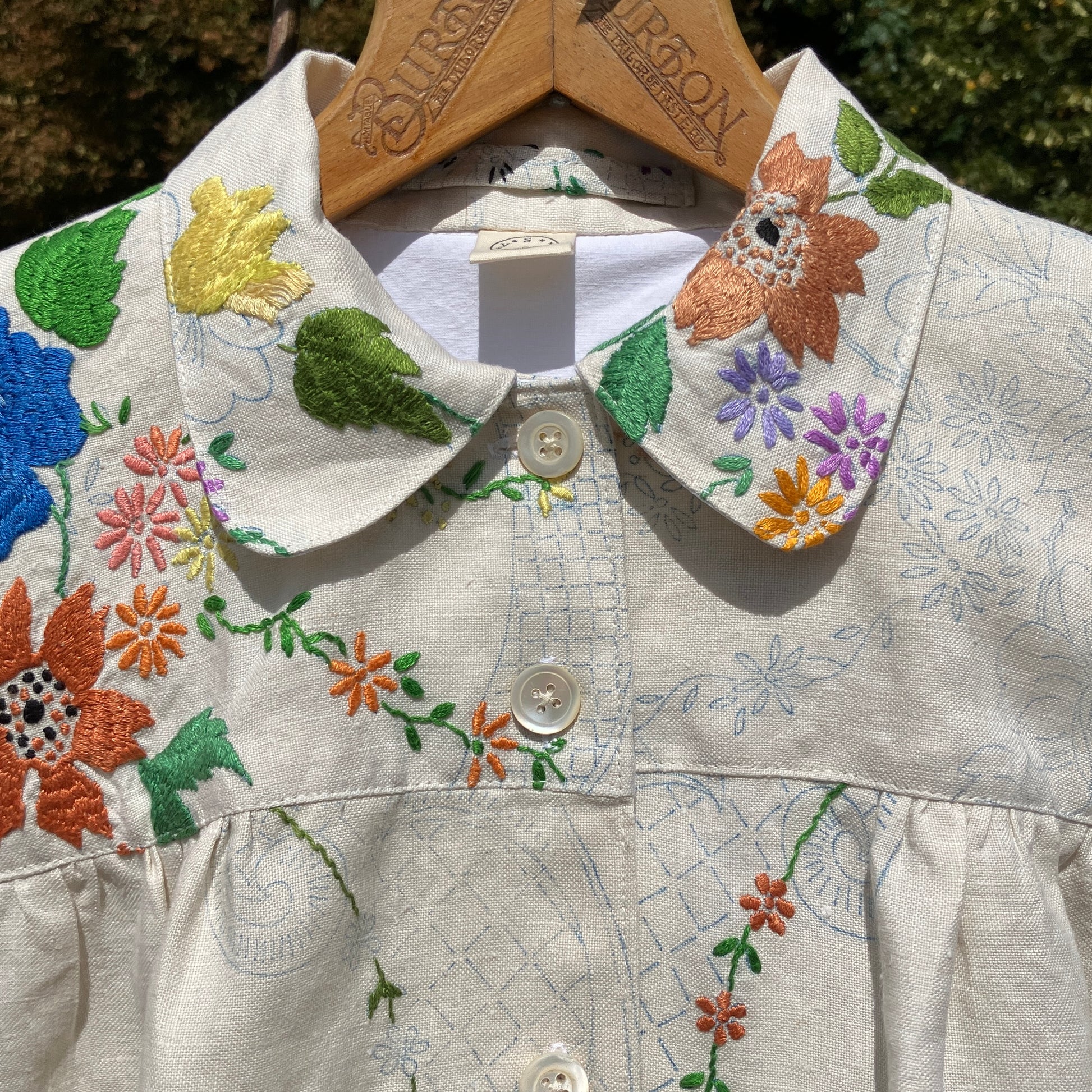 Blouse made from a recycled part-embroidered vintage linen tablecloth
