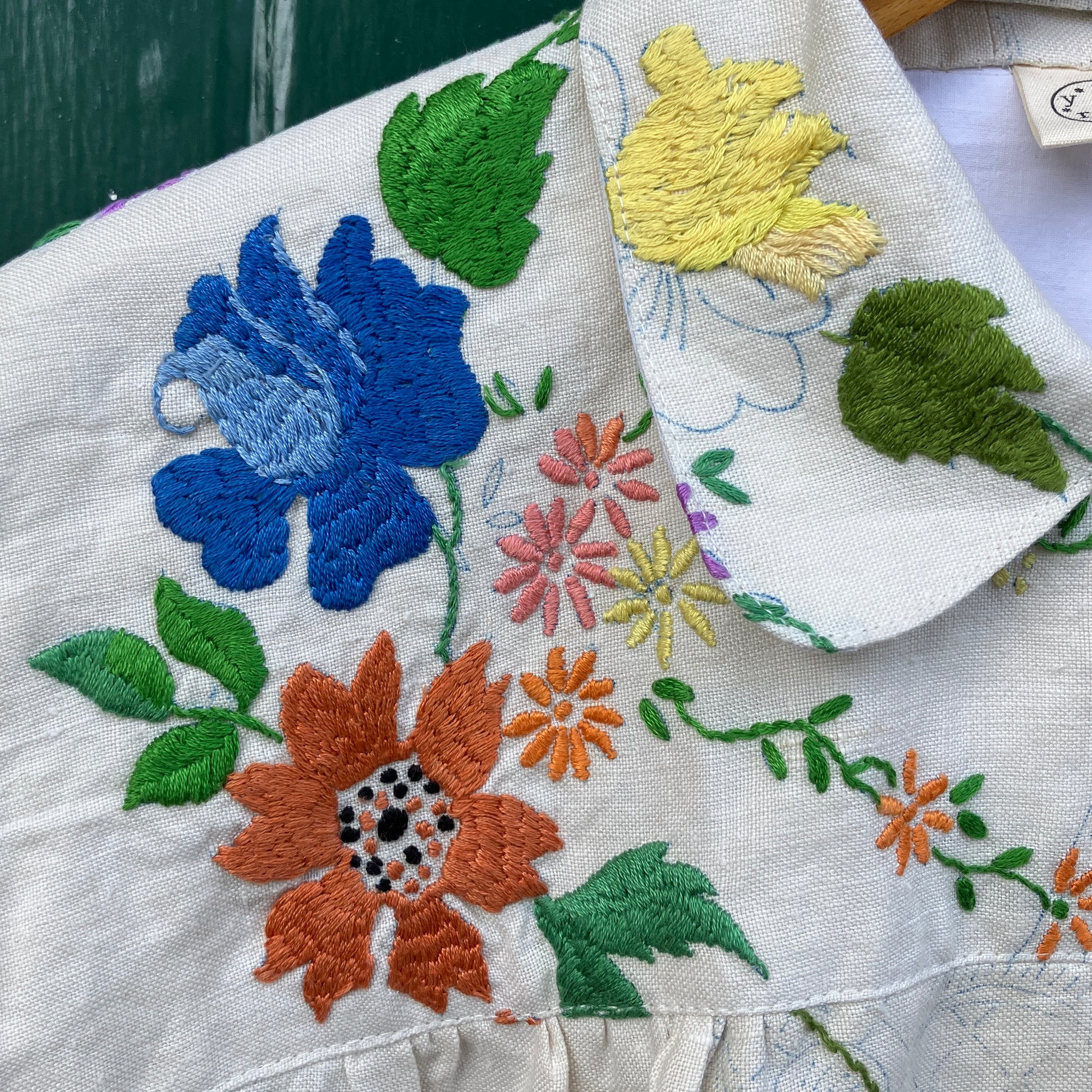 Blouse made from a recycled part-embroidered vintage linen tablecloth