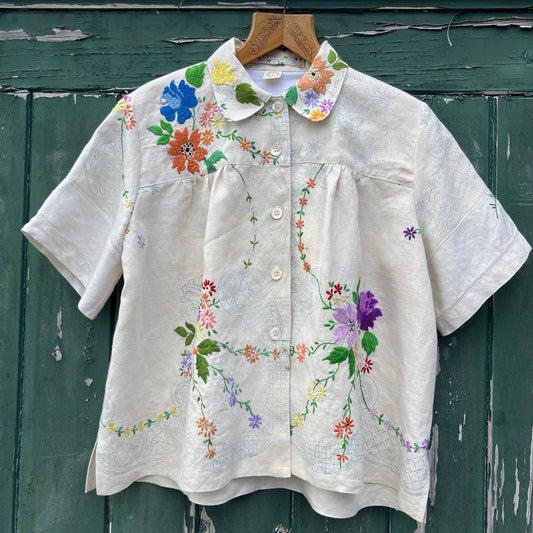 Blouse made from a recycled part-embroidered vintage linen tablecloth