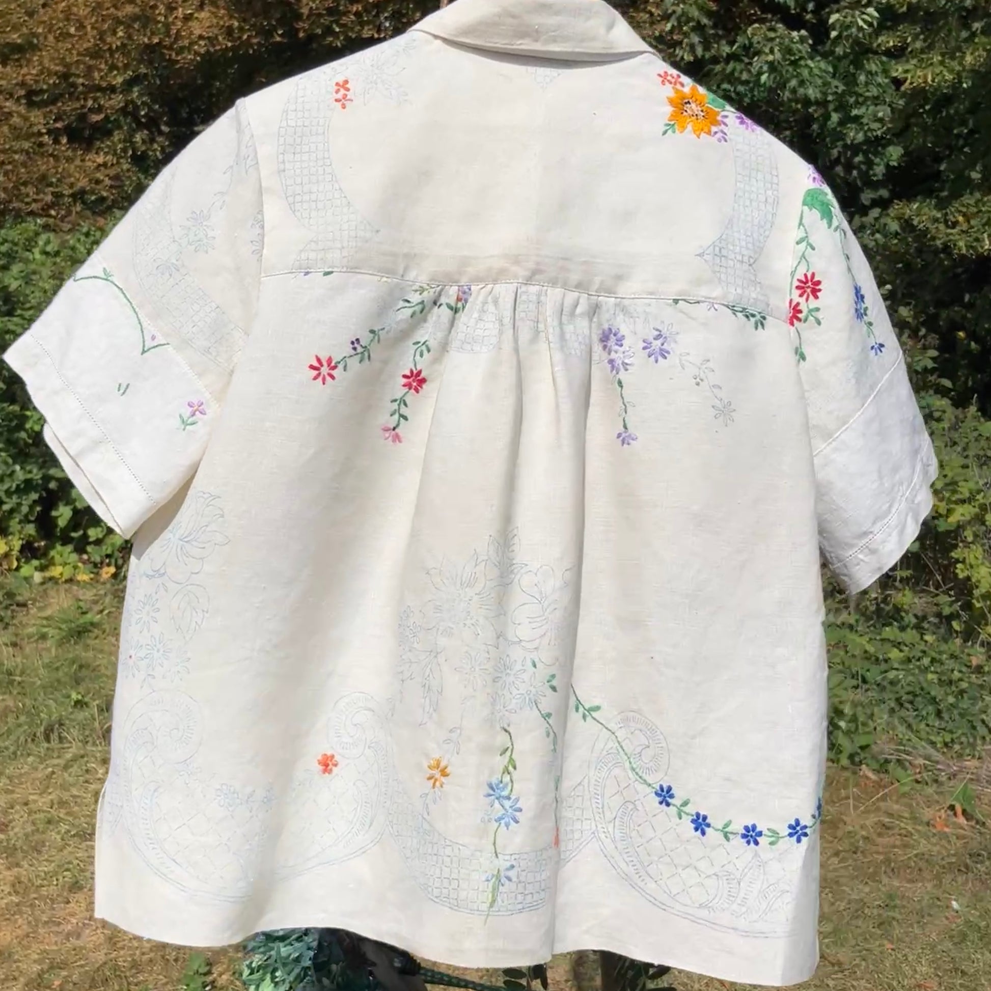 Blouse made from a recycled part-embroidered vintage linen tablecloth