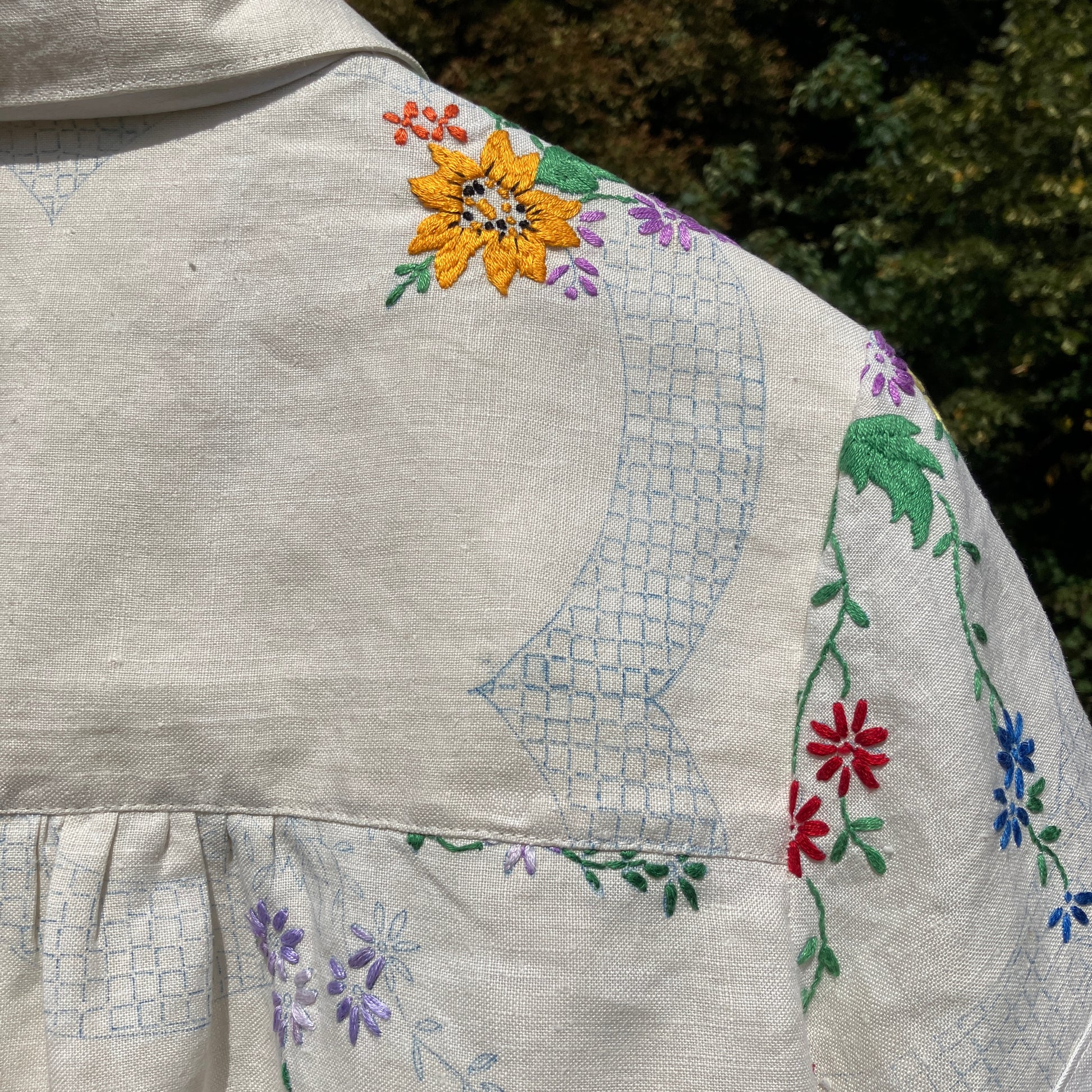 Blouse made from a recycled part-embroidered vintage linen tablecloth