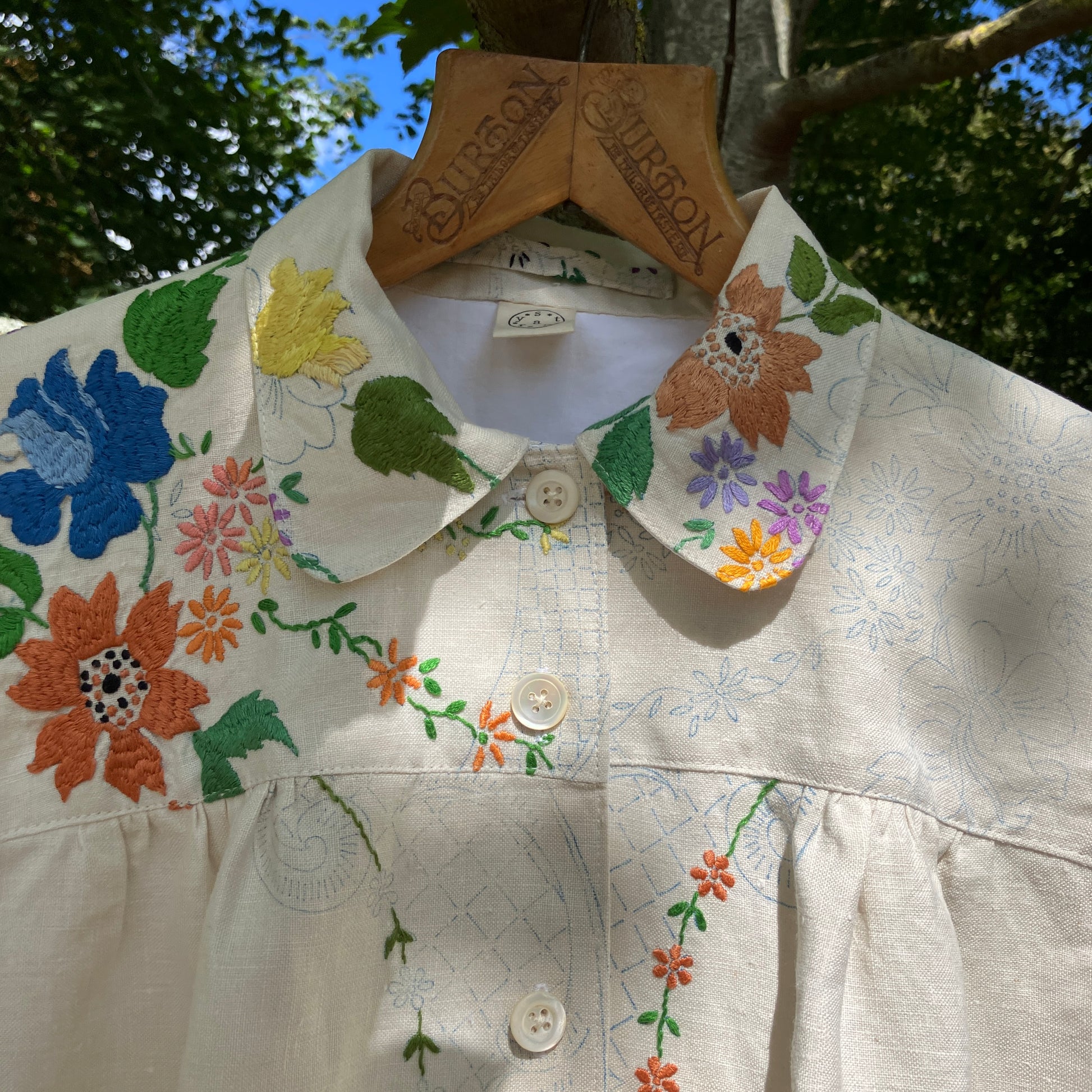 Blouse made from a recycled part-embroidered vintage linen tablecloth