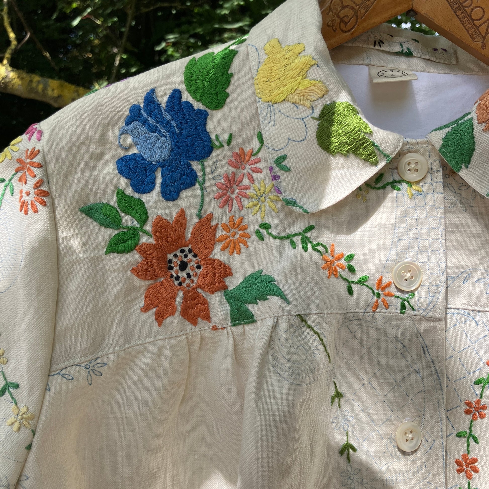 Blouse made from a recycled part-embroidered vintage linen tablecloth