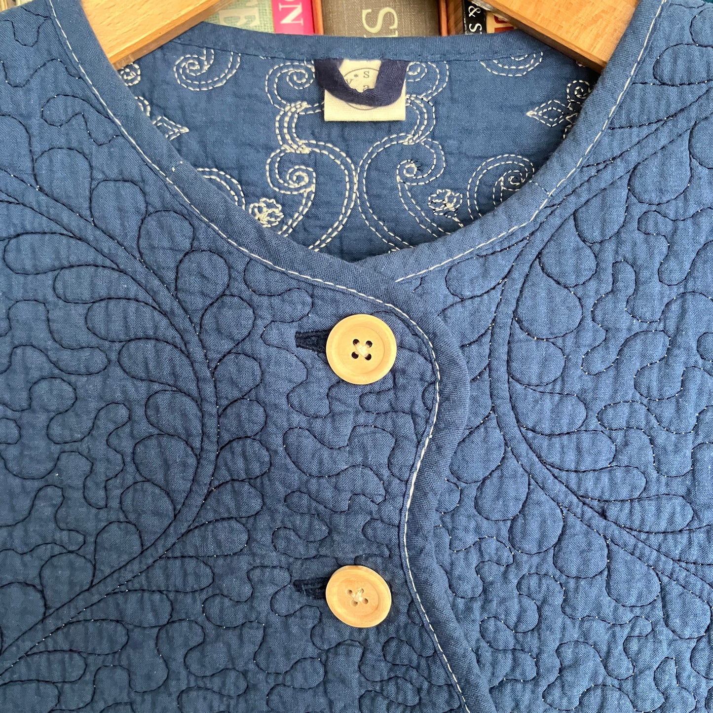 blue vest made from a recycled quilt