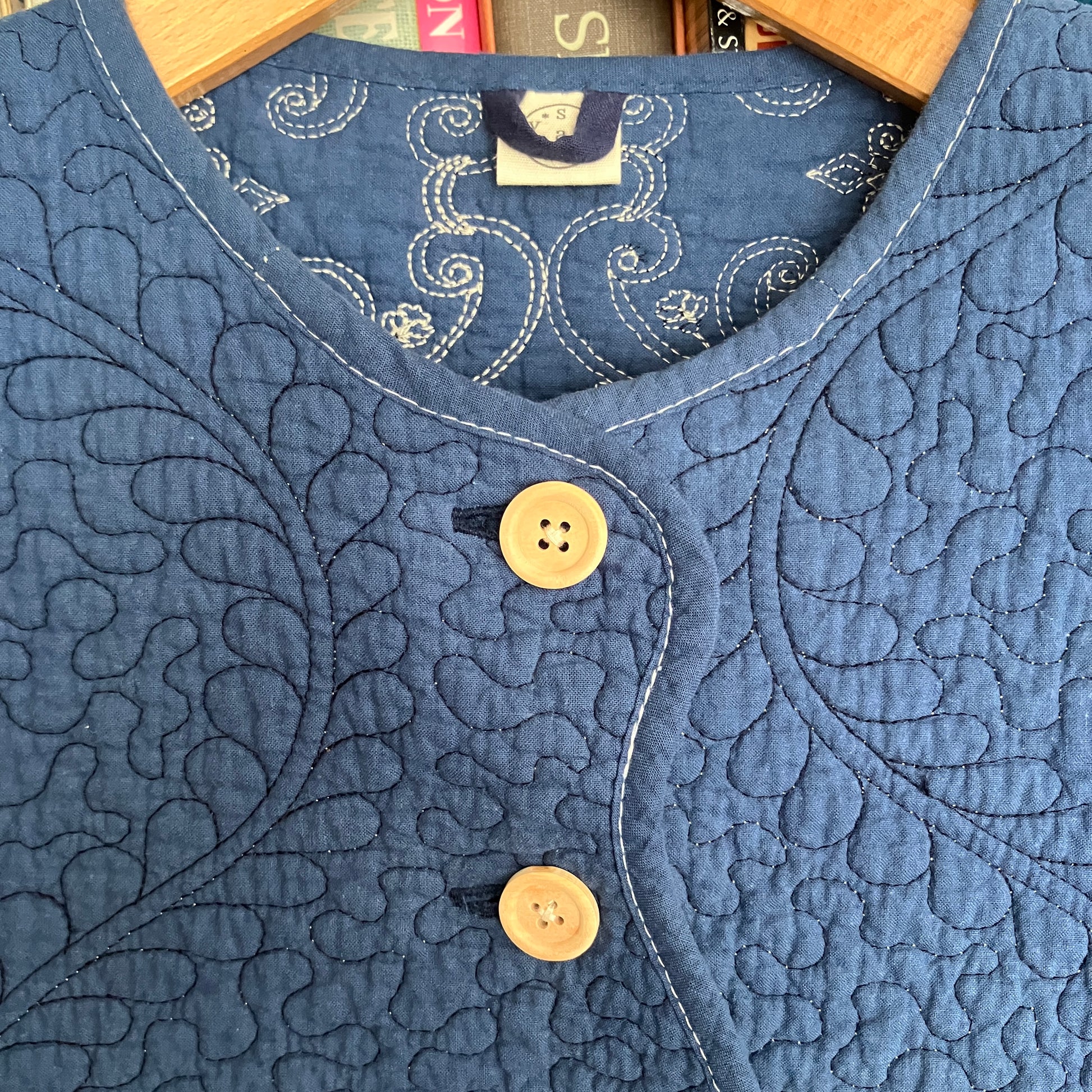 blue vest made from a recycled quilt