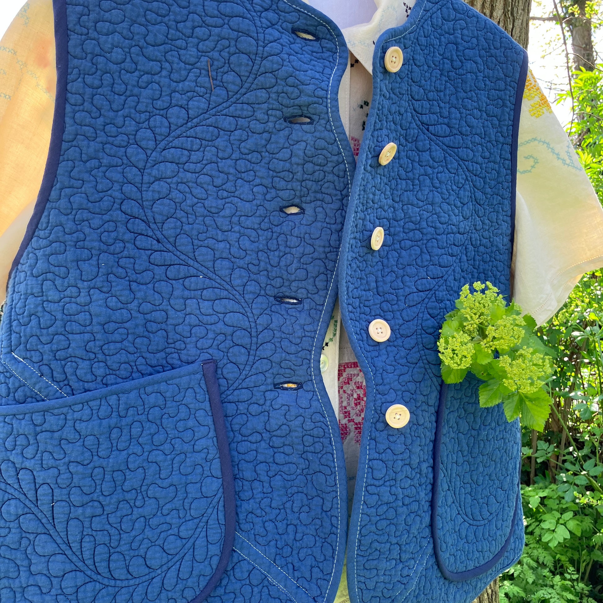 blue vest made from a recycled quilt