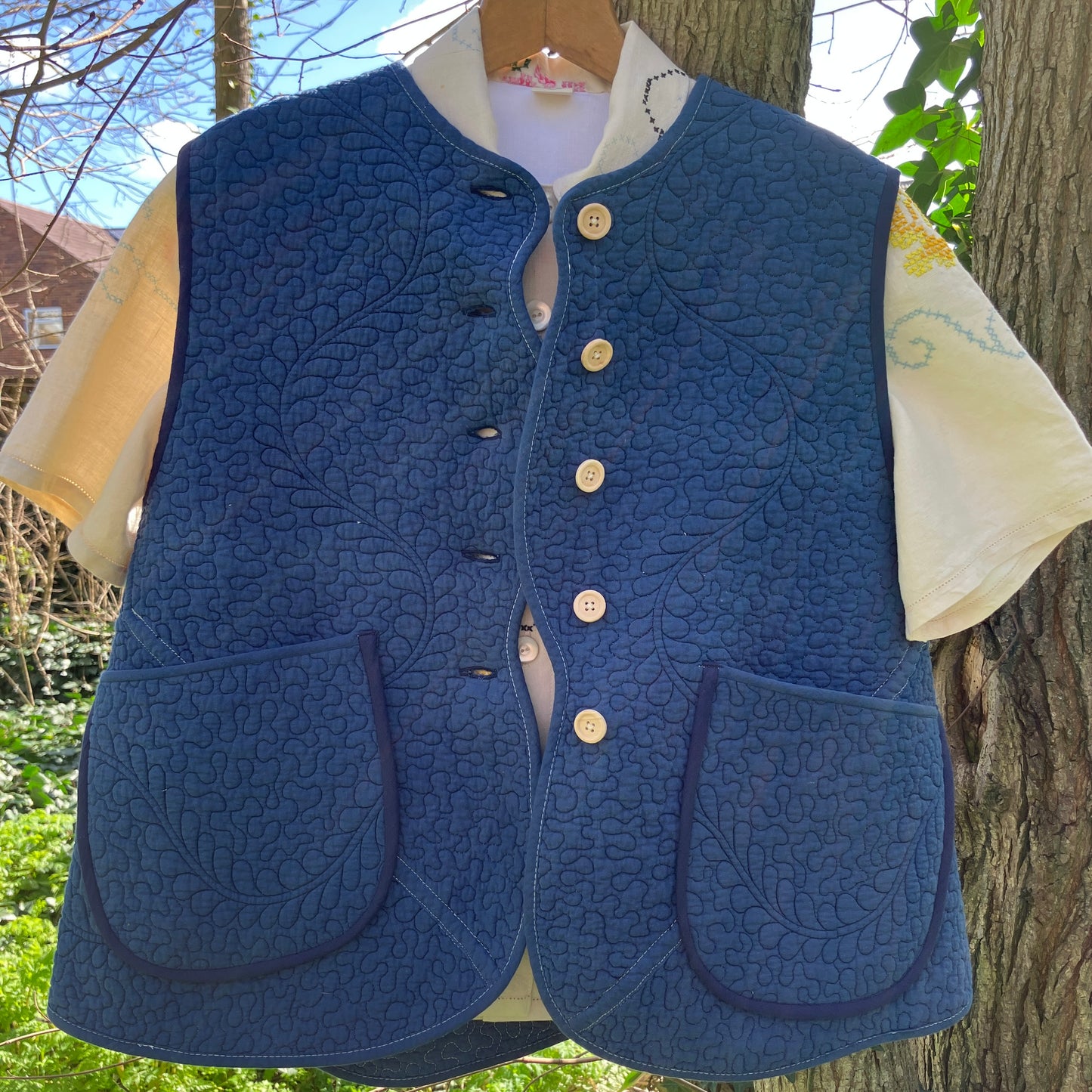blue vest made from a recycled quilt