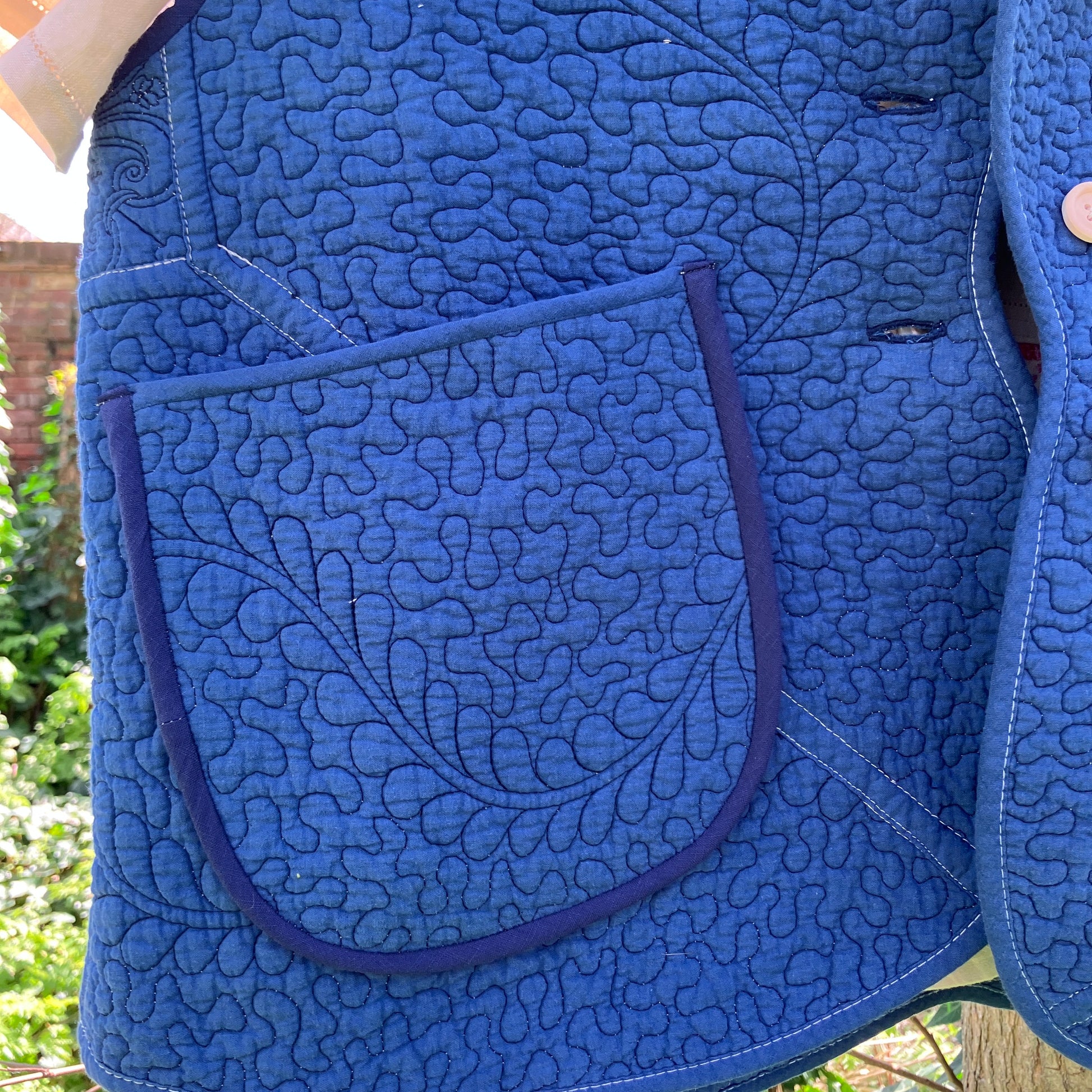 blue vest made from a recycled quilt