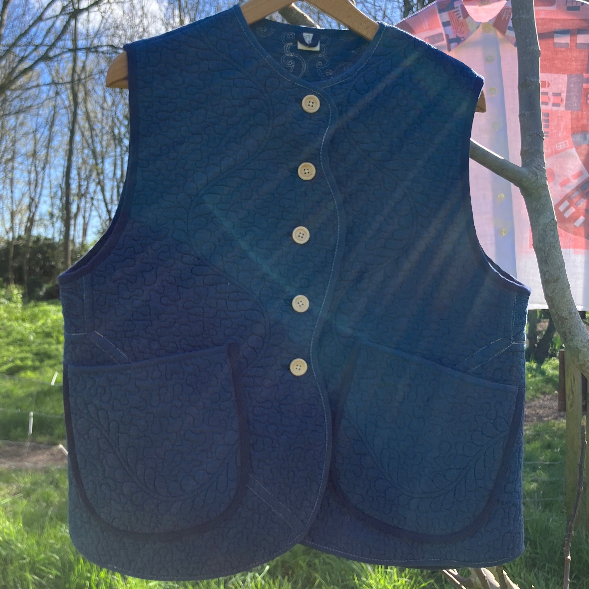 blue vest made from a recycled quilt