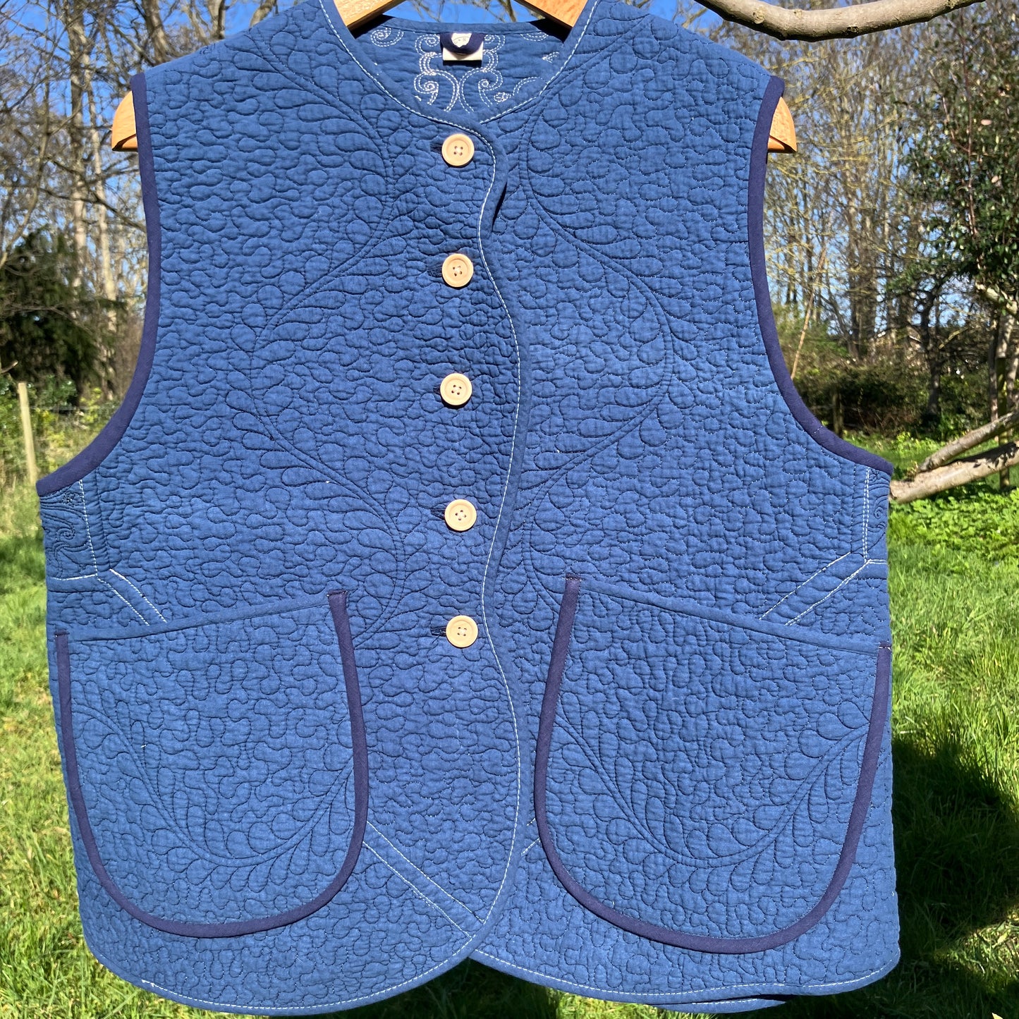 blue vest made from a recycled quilt