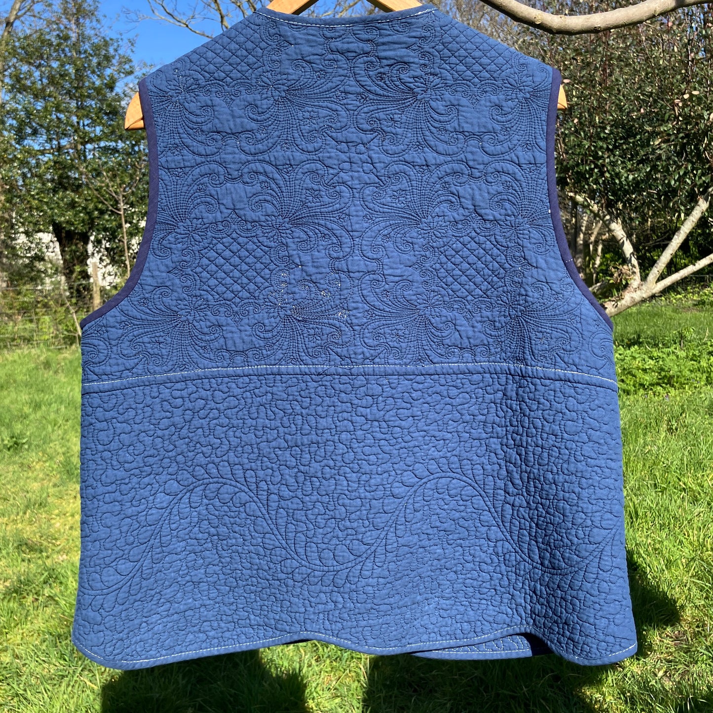 blue vest made from a recycled quilt