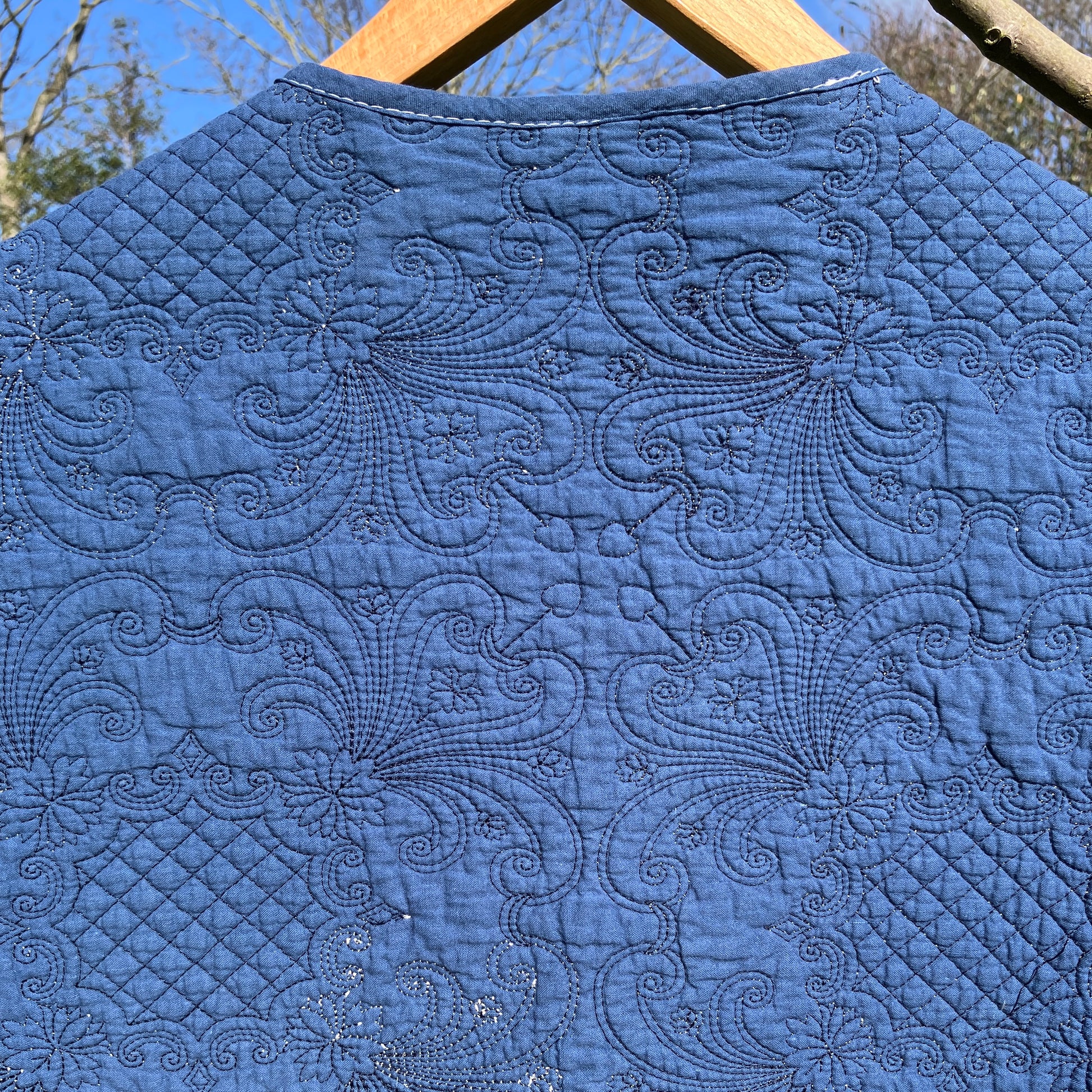 blue vest made from a recycled quilt