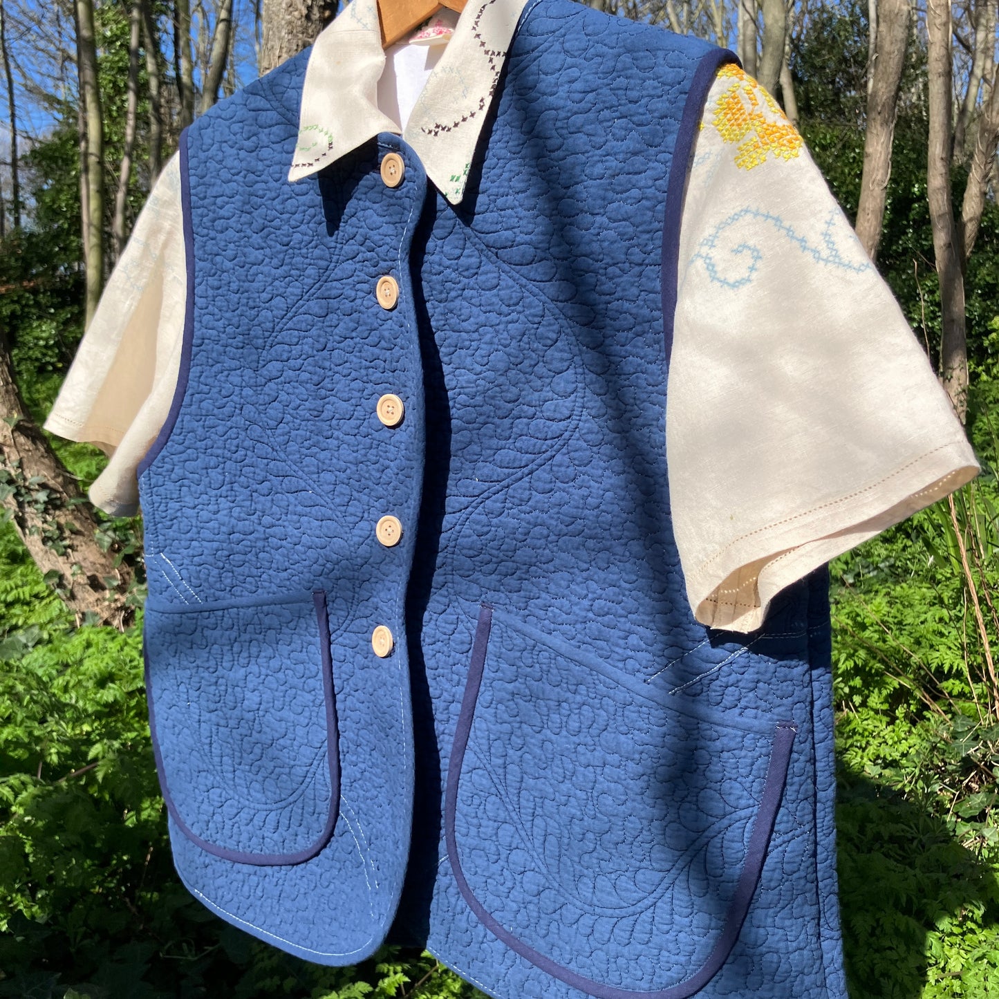 blue vest made from a recycled quilt