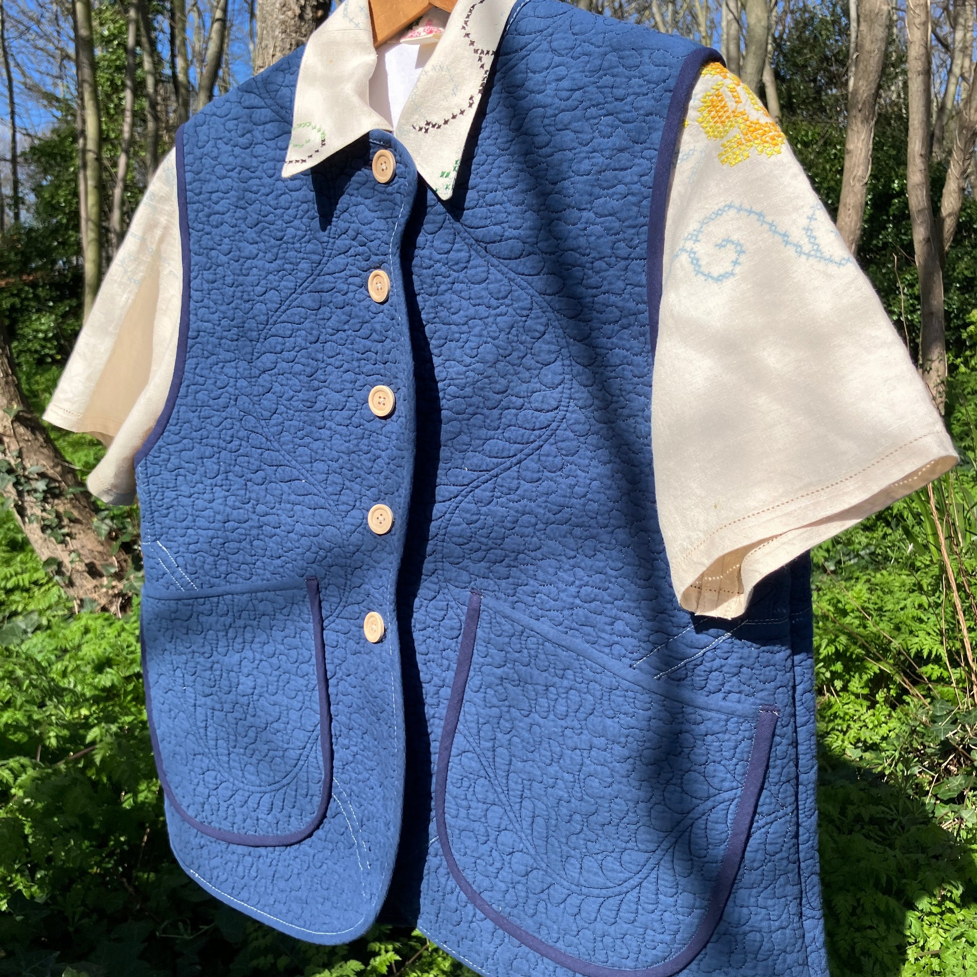 blue vest made from a recycled quilt