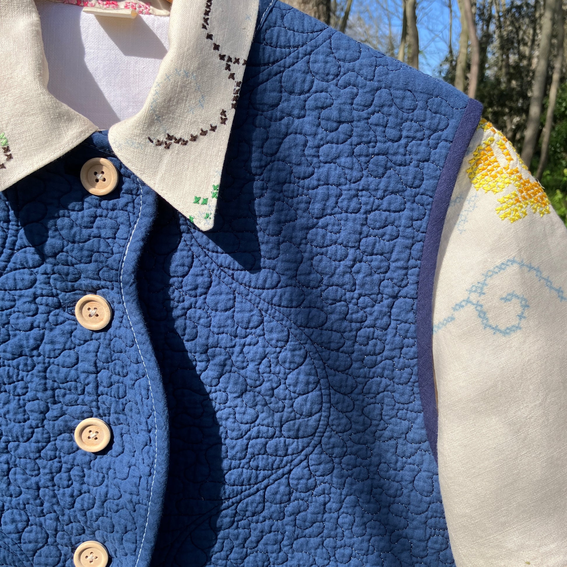 blue vest made from a recycled quilt