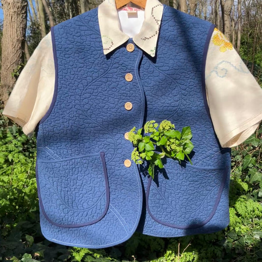 blue vest made from a recycled quilt