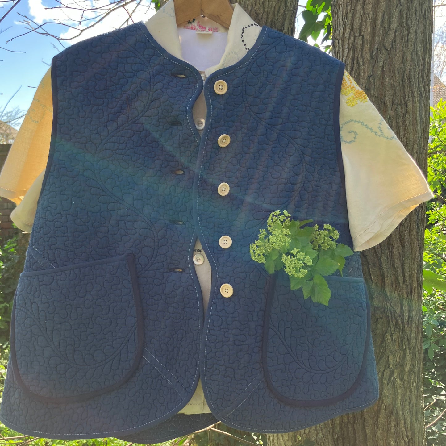 blue vest made from a recycled quilt
