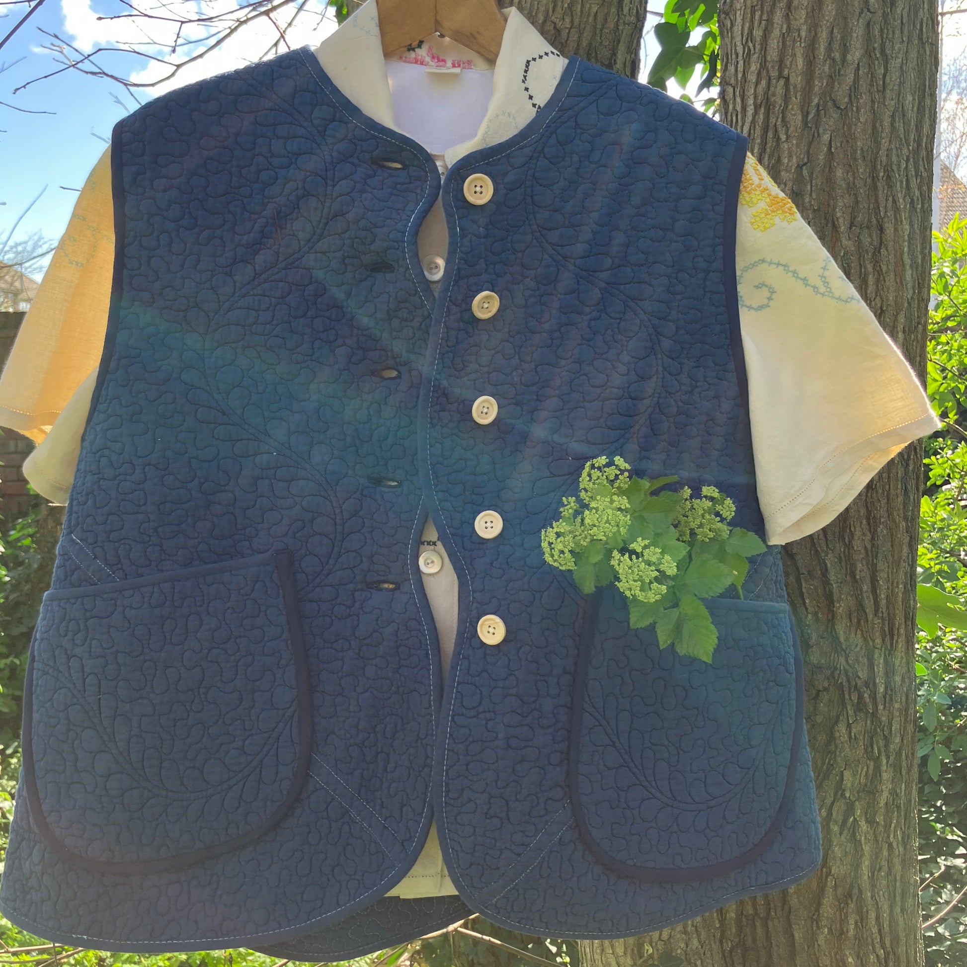 blue vest made from a recycled quilt