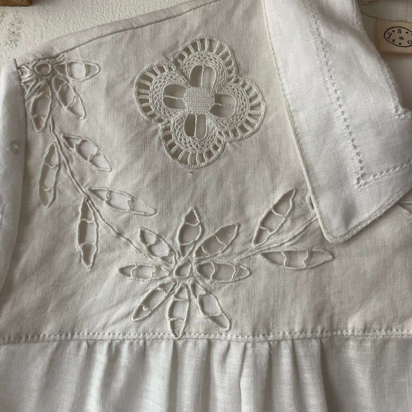 Short-sleeved white swingy shirt made from vintage cutwork linen and cotton cutwork table and tray cloths.