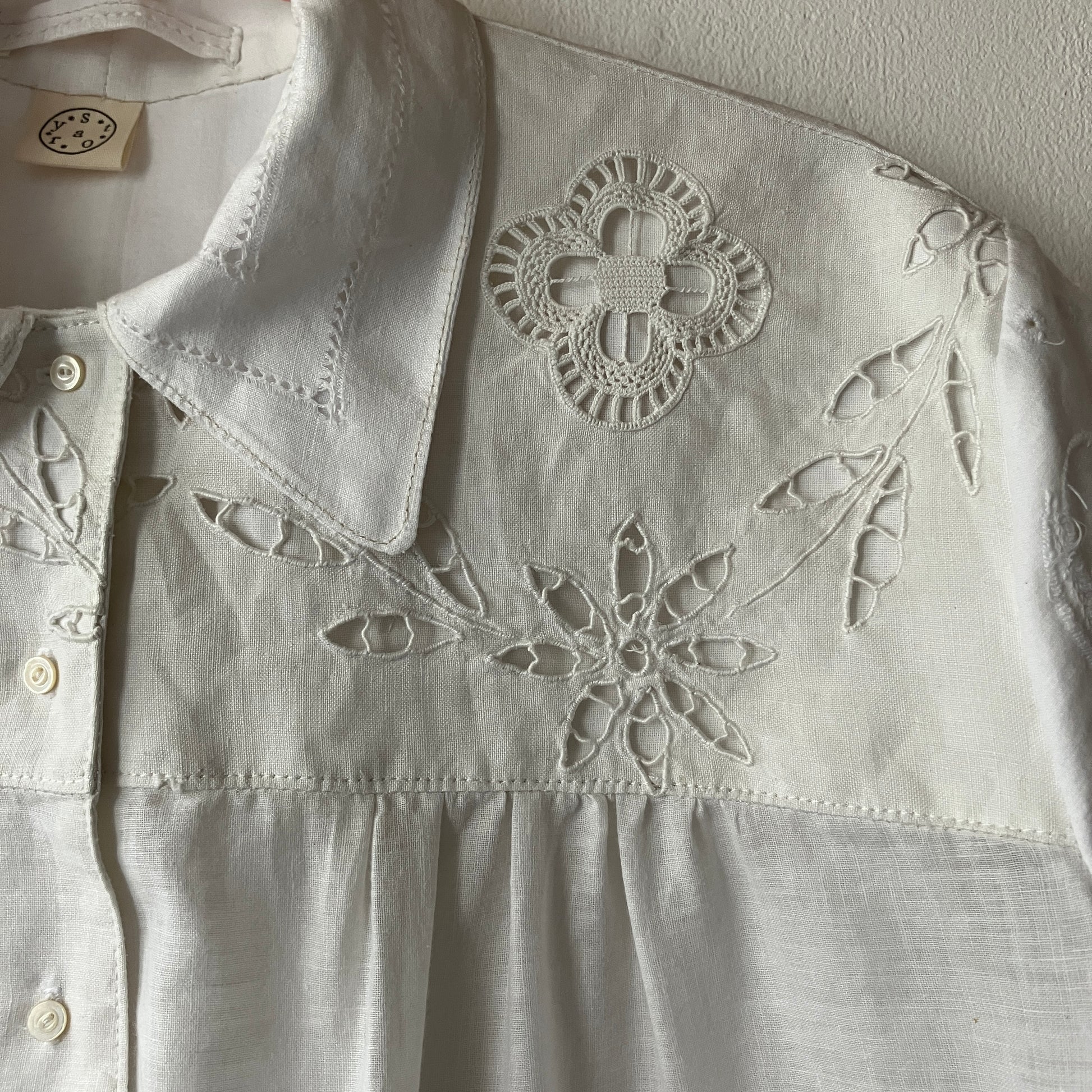 Short-sleeved white swingy shirt made from vintage cutwork linen and cotton cutwork table and tray cloths.