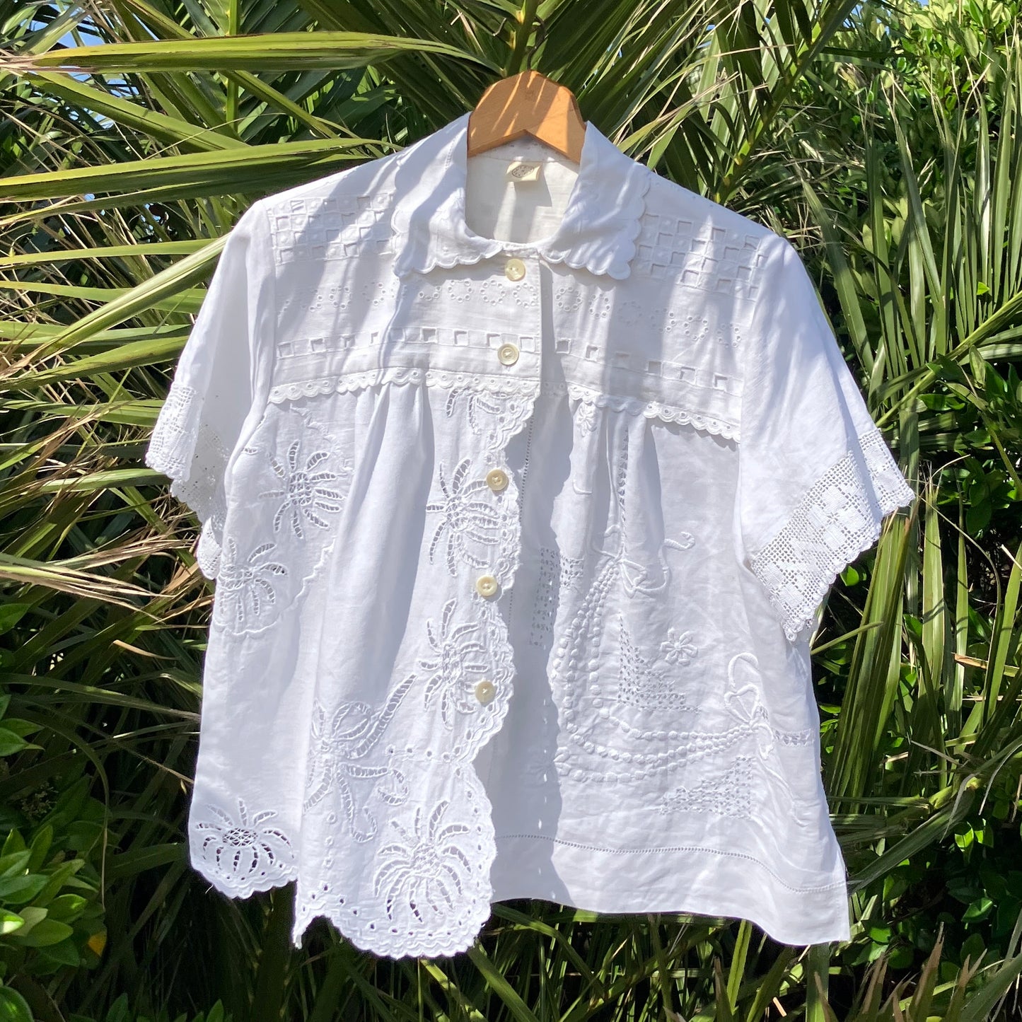 Beautiful shirt made from a patchwork of white reclaimed vintage cotton and linen tablecloths.