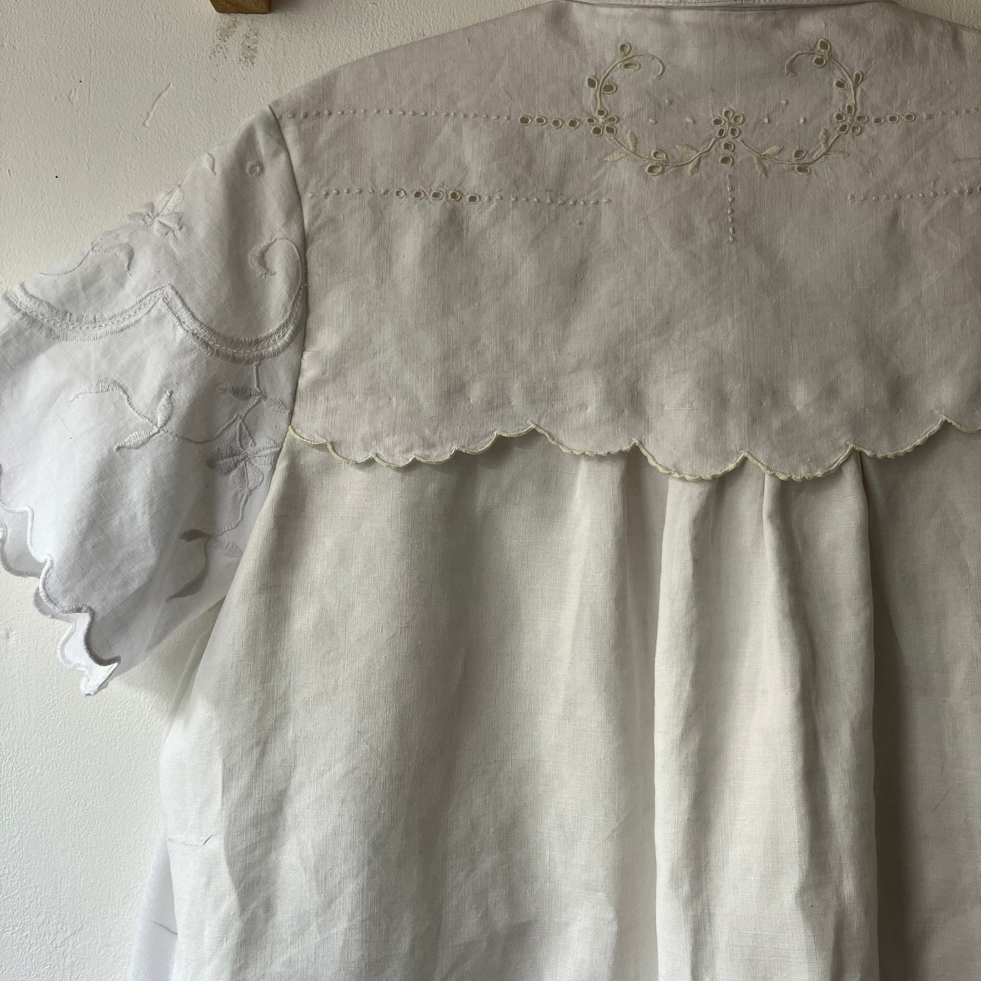 Short-sleeved white swingy shirt made from vintage cutwork linen and cotton cutwork table and tray cloths.