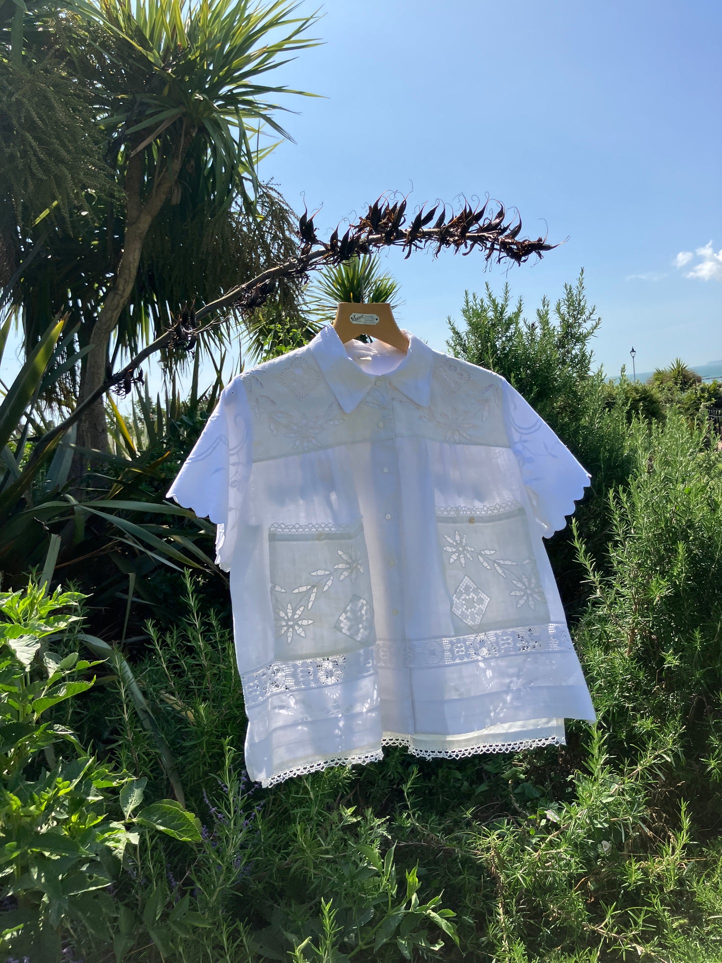Short-sleeved white swingy shirt made from vintage cutwork linen and cotton cutwork table and tray cloths.