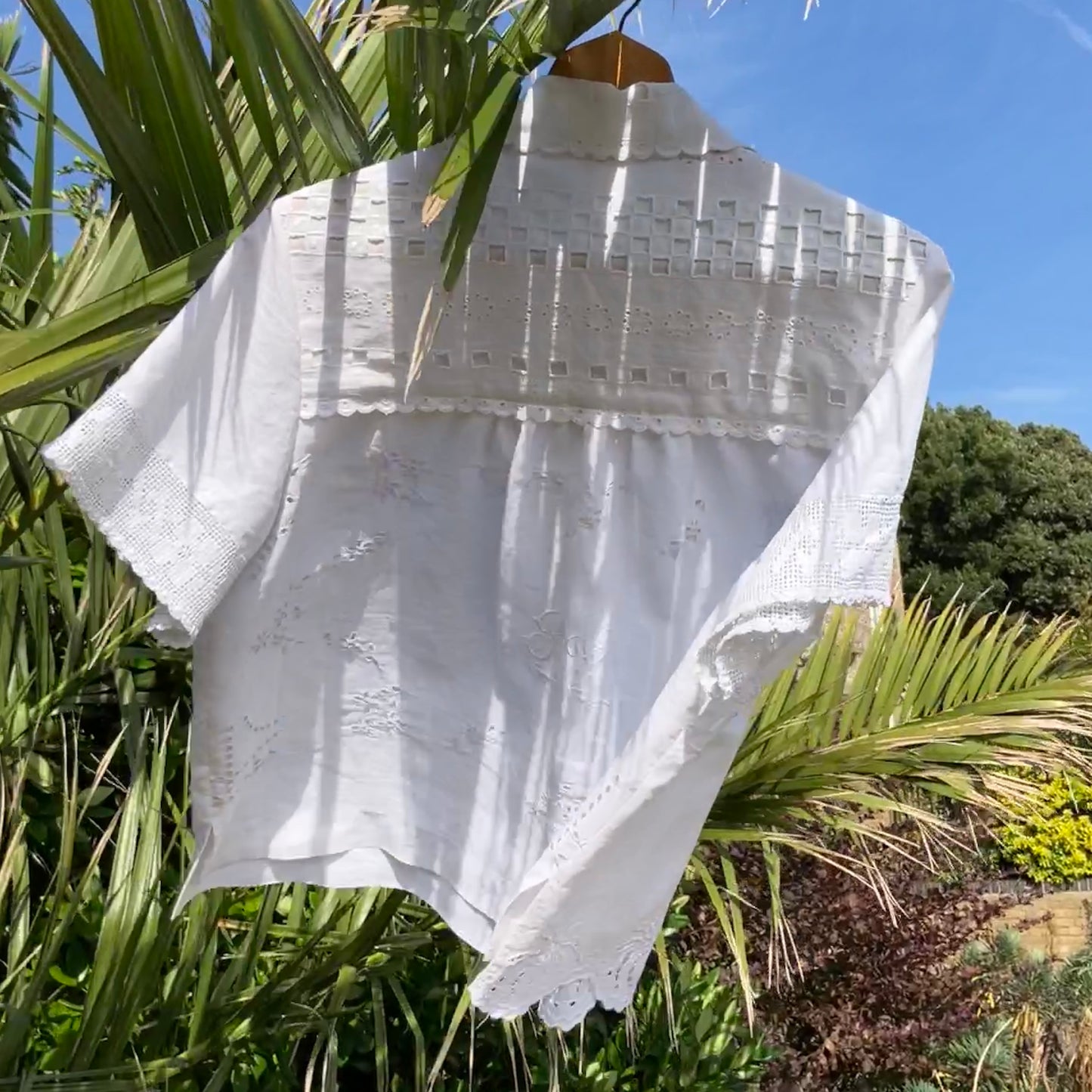 Beautiful shirt made from a patchwork of white reclaimed vintage cotton and linen tablecloths.