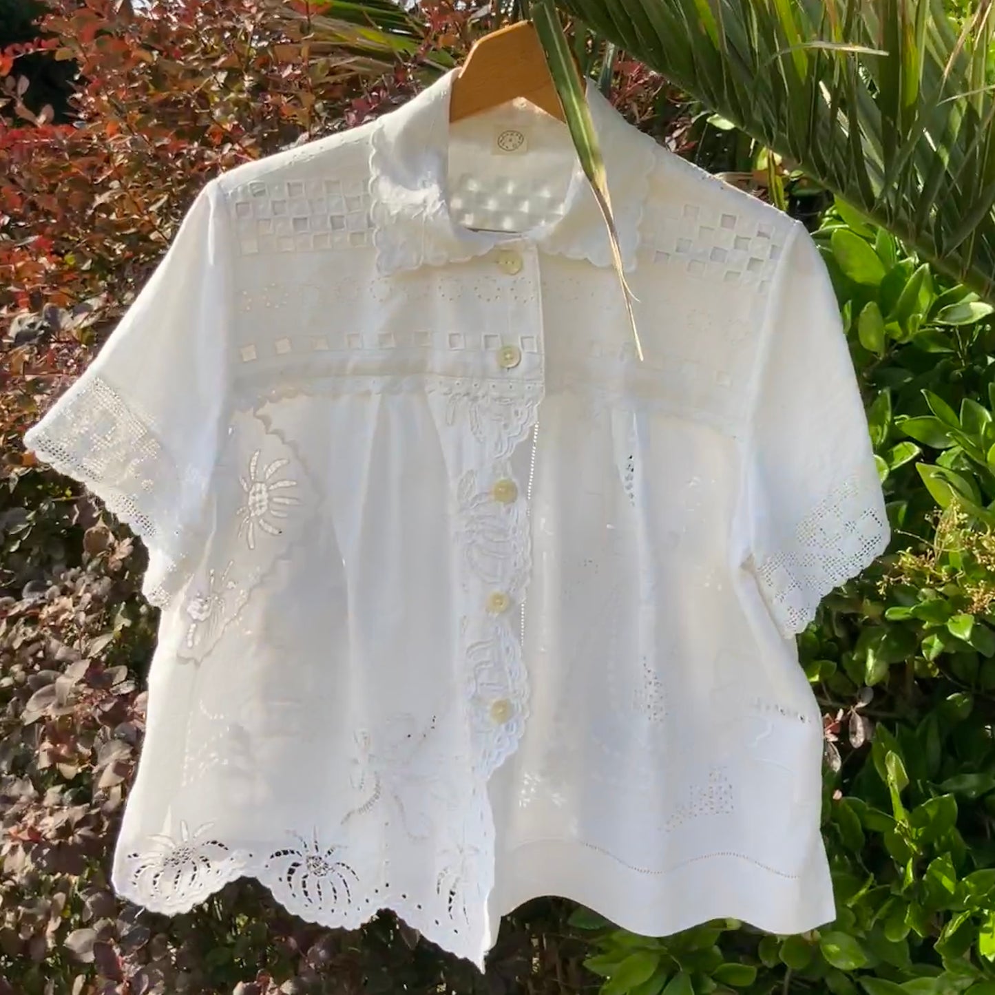 Beautiful shirt made from a patchwork of white reclaimed vintage cotton and linen tablecloths.