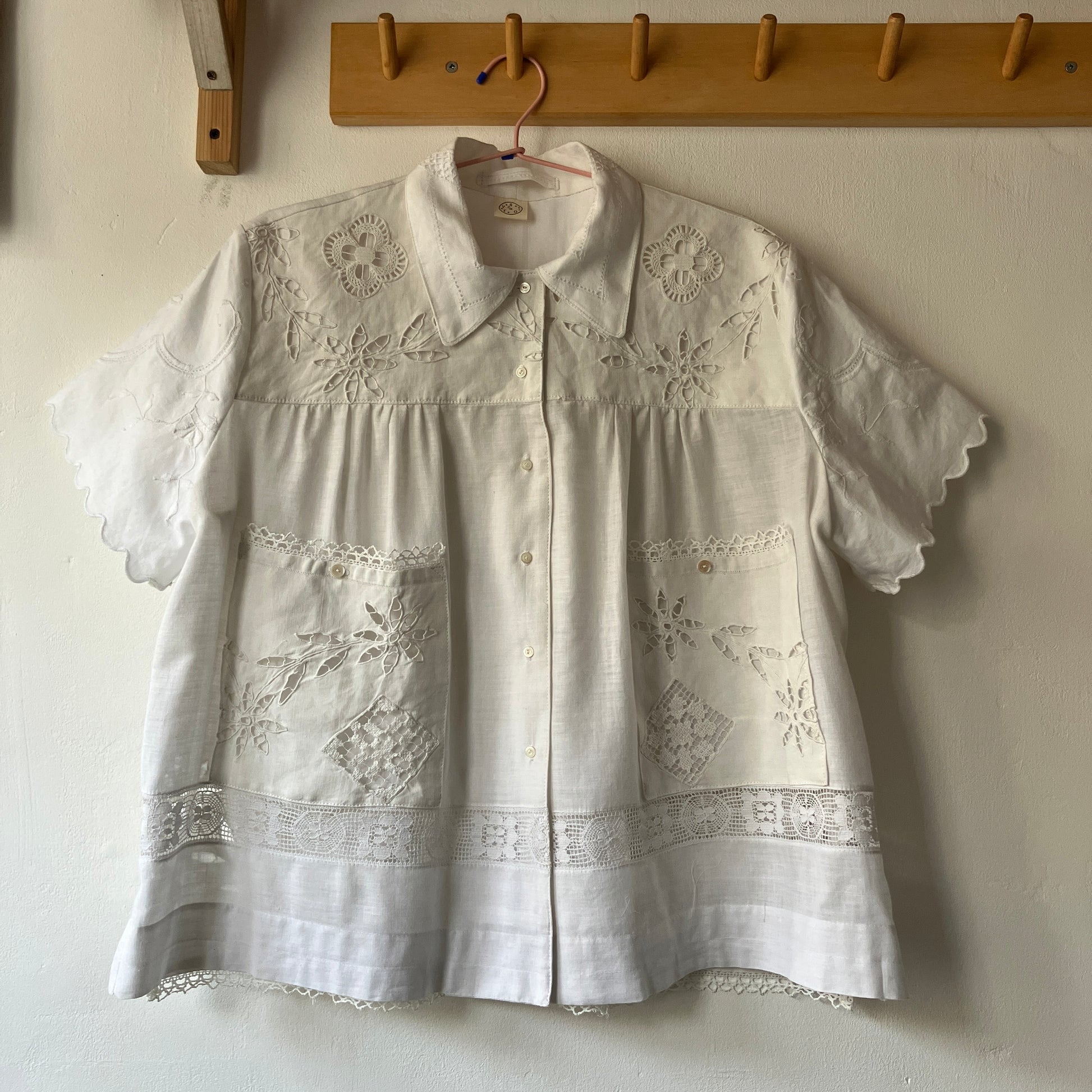 Short-sleeved white swingy shirt made from vintage cutwork linen and cotton cutwork table and tray cloths.