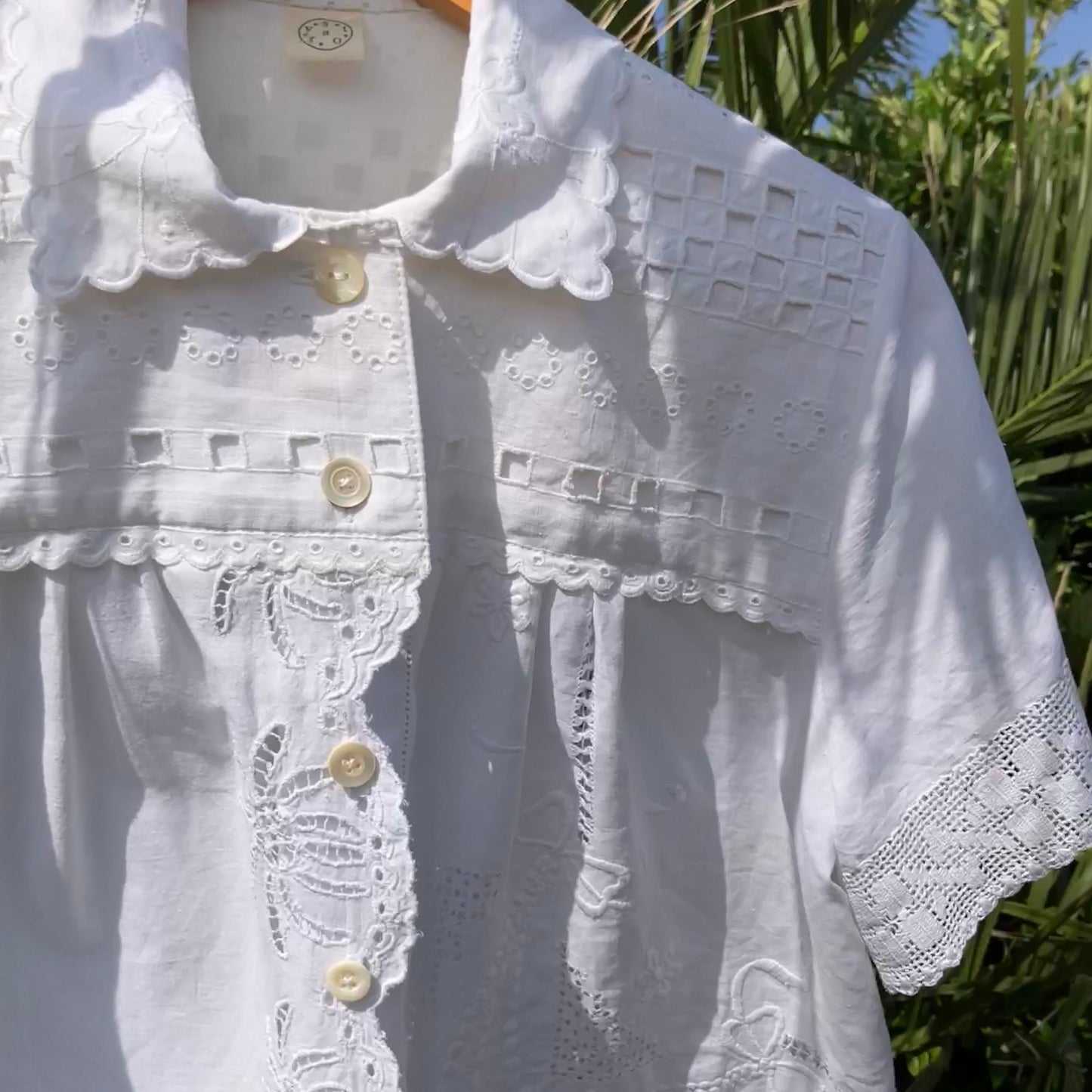 Beautiful shirt made from a patchwork of white reclaimed vintage cotton and linen tablecloths.