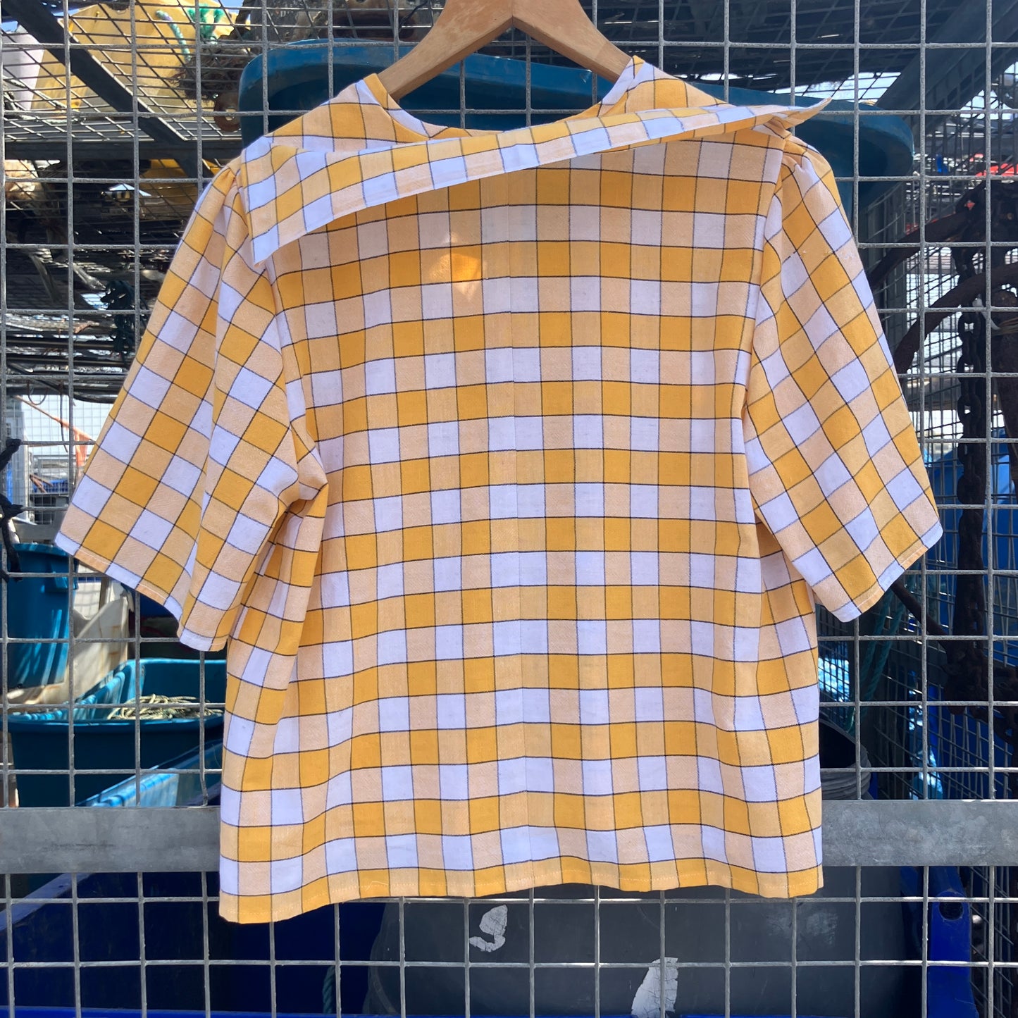 Short sleeved sailor-collar top made from a reclaimed yellow and white checked vintage tablecloth