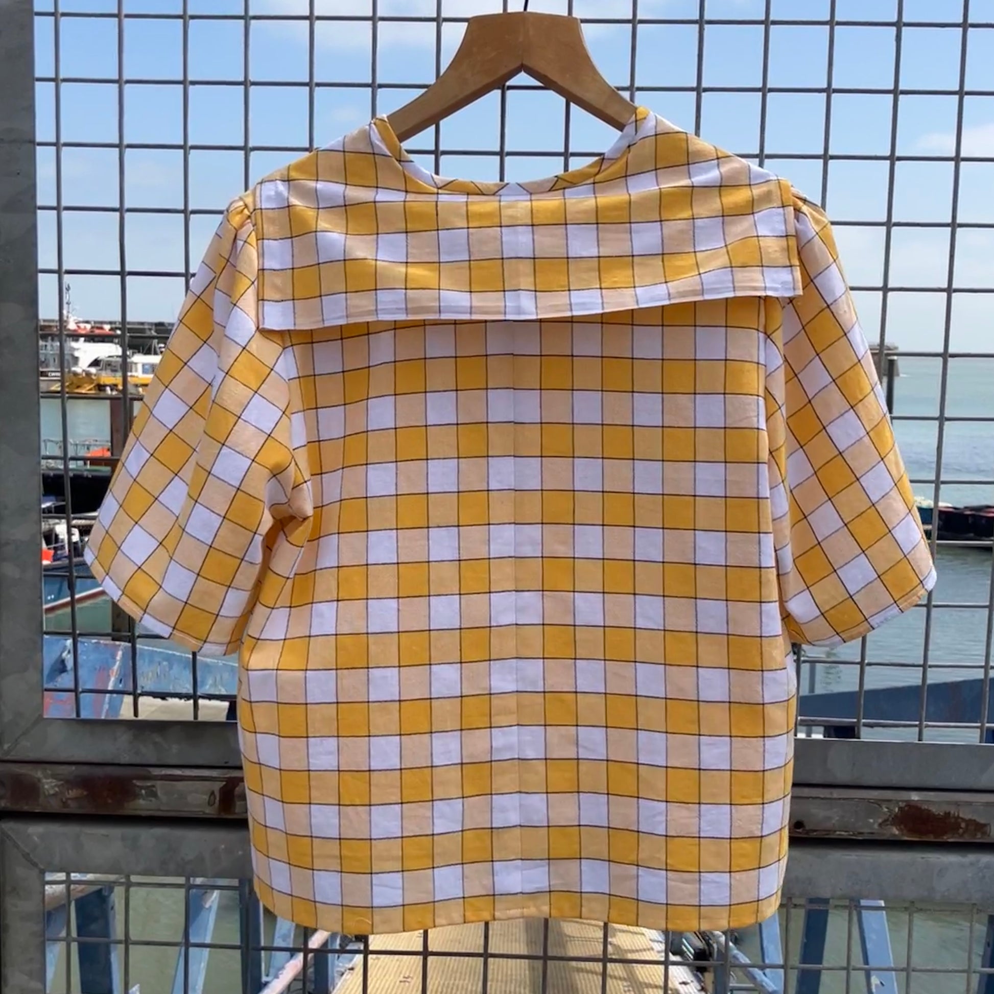 Short sleeved sailor-collar top made from a reclaimed yellow and white checked vintage tablecloth