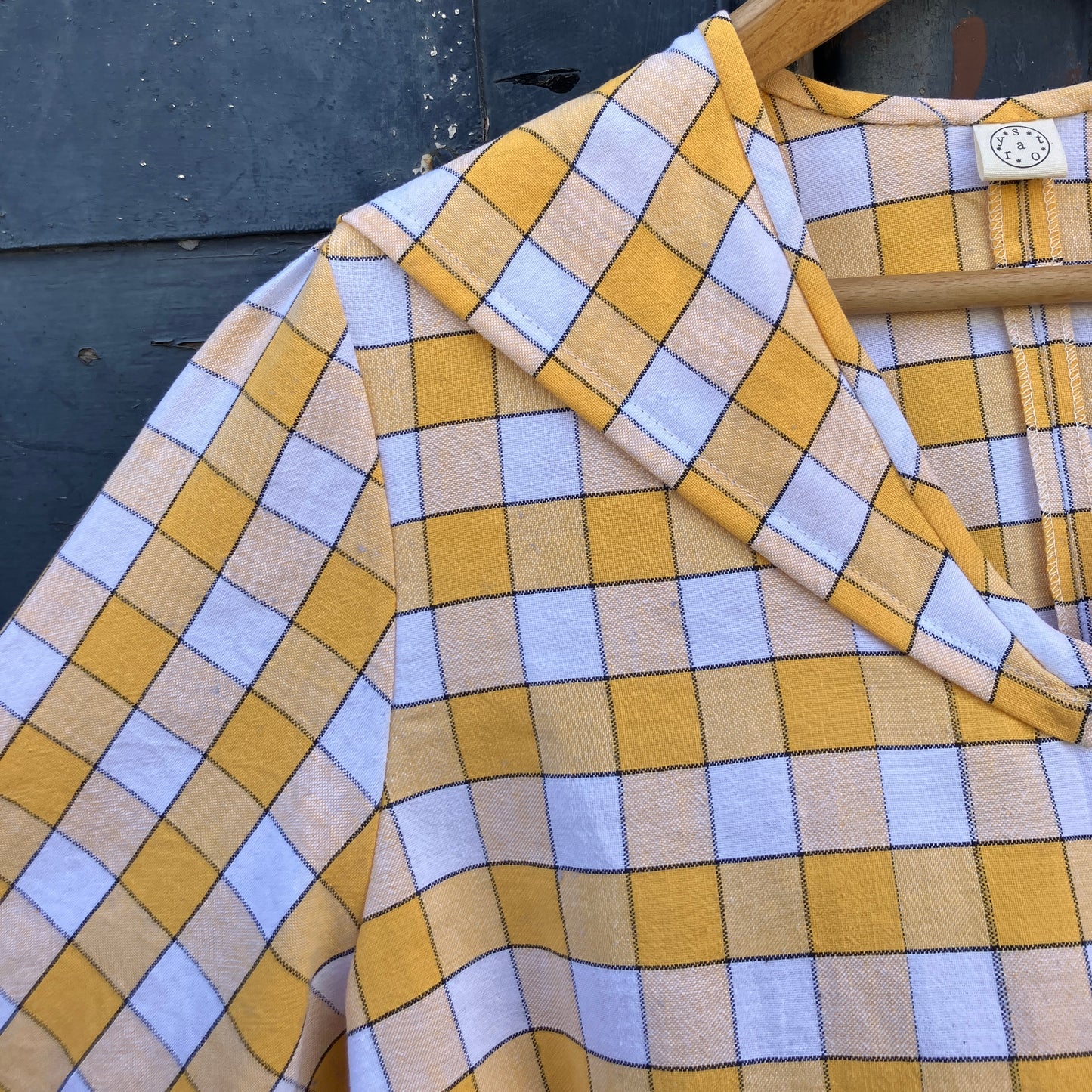 Short sleeved sailor-collar top made from a reclaimed yellow and white checked vintage tablecloth