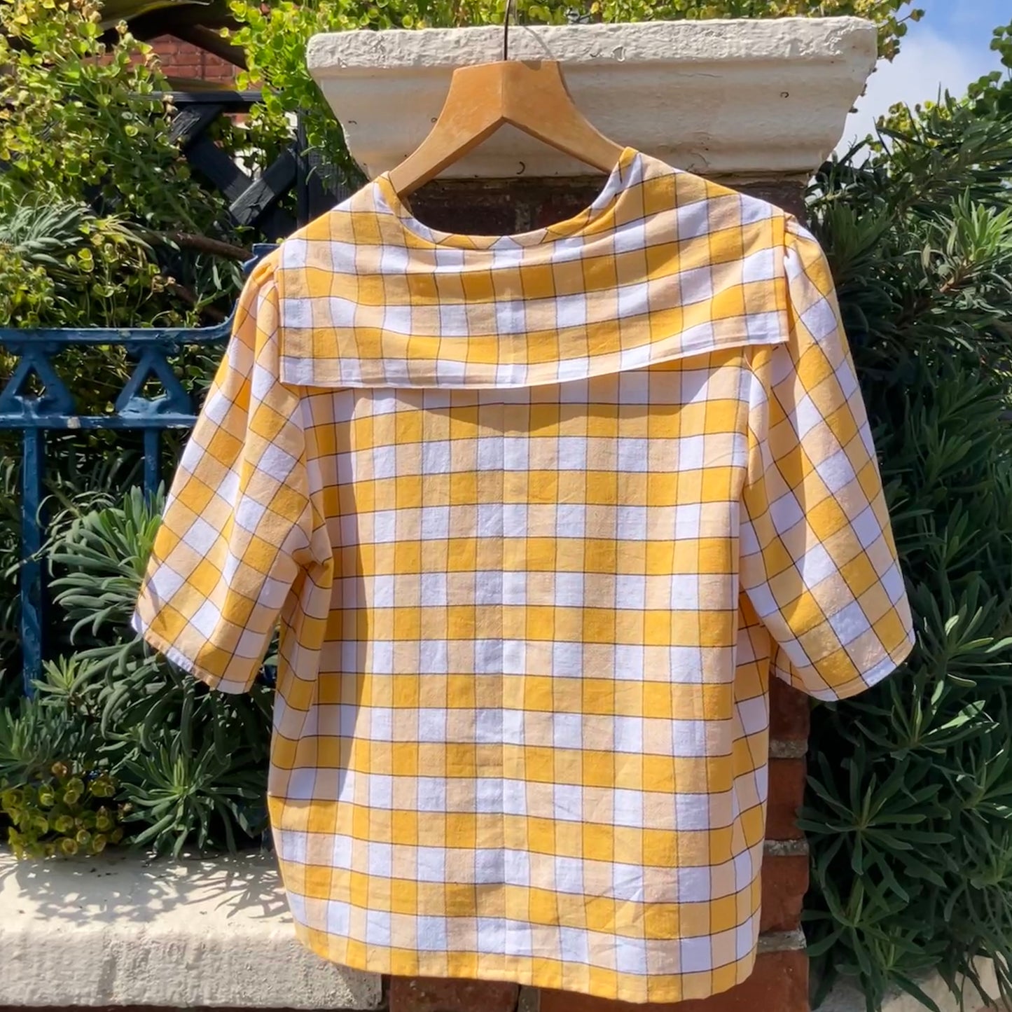 Short sleeved sailor-collar top made from a reclaimed yellow and white checked vintage tablecloth