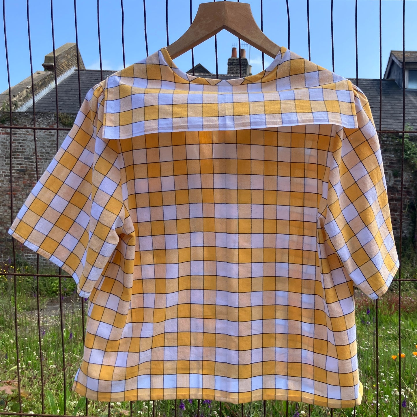 Short sleeved sailor-collar top made from a reclaimed yellow and white checked vintage tablecloth