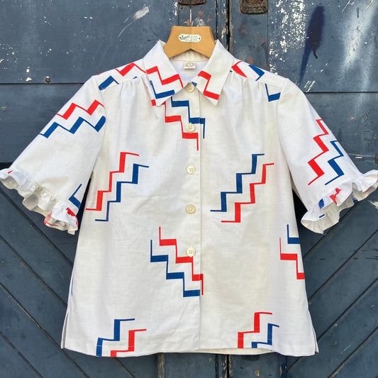 Geometric-print shirt with fancy ruffles around the sleeves