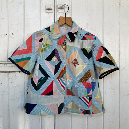 Short-sleeved shirt made from a found piece of 60s/70s patchwork in various bright and pastel colours