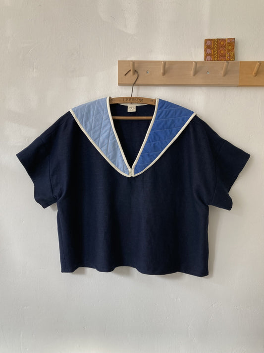 Hand sewn navy blue linen shirt made from reclaimed fabric with a quilted patchwork sailor collar