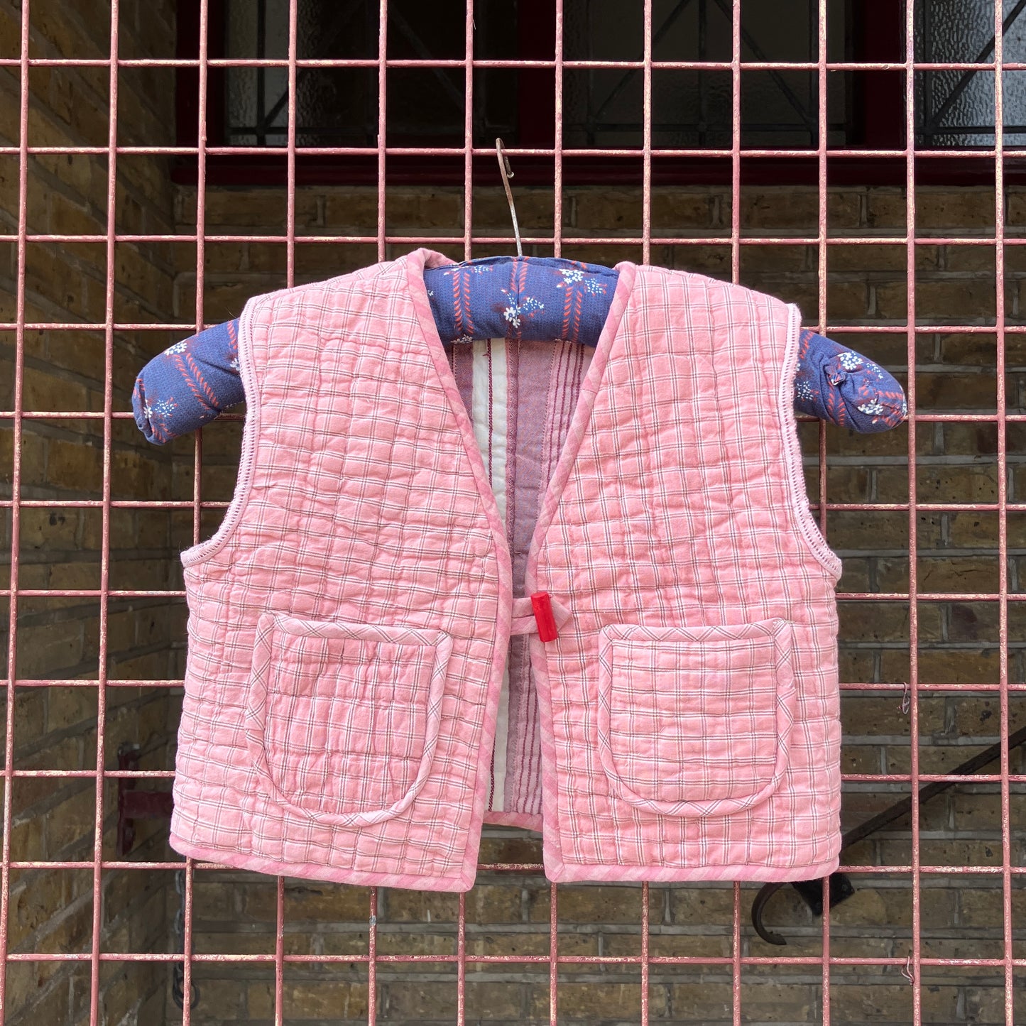kids vest/gilet/waistcoat made from offcuts of a reclaimed pink quilt