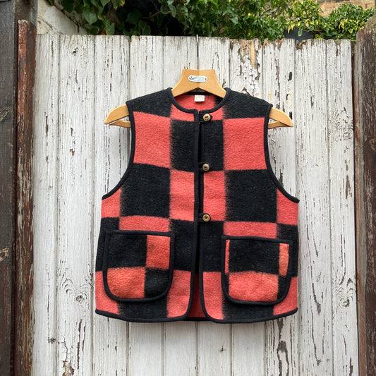 Cosy gilet/waistcoat/bodywarmer made from a fabulous pink and black checkerboard reclaimed wool blanket.