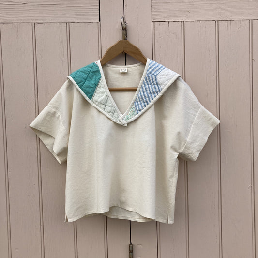 Boxy short-sleeved top made from found calico with a sailor collar cut from an antique patchwork quilt